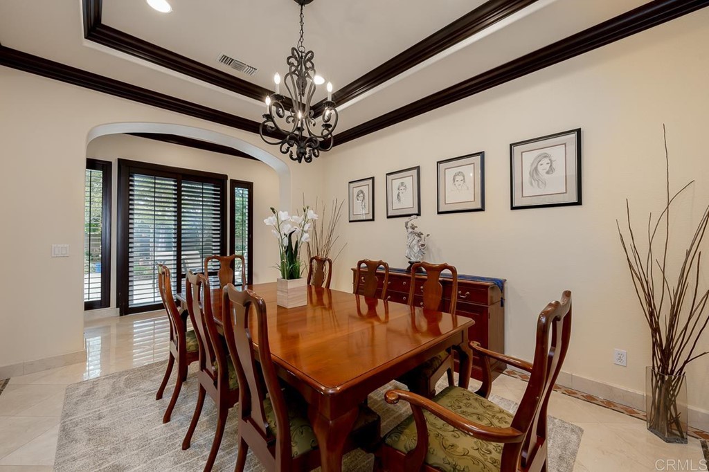 2786 Sutter Ridge Drive Chula Vista, CA 91914 - Photo 12 of 58 a view of a dining room with furniture and a chandelier