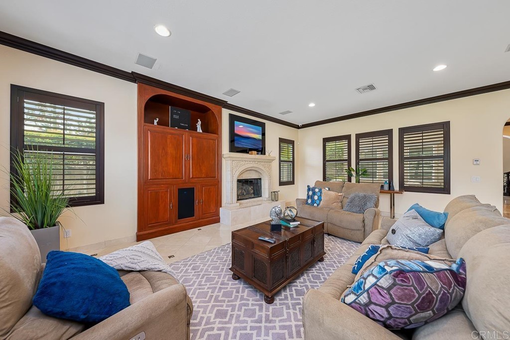 2786 Sutter Ridge Drive Chula Vista, CA 91914 - Photo 20 of 58 a living room with furniture fireplace and a large window