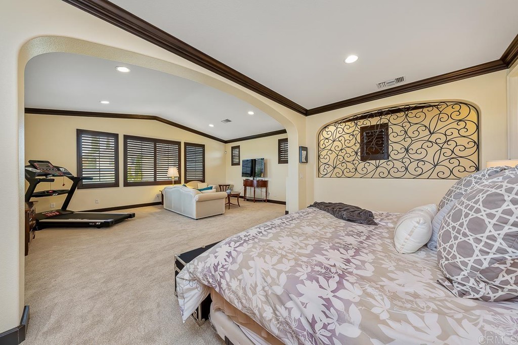 2786 Sutter Ridge Drive Chula Vista, CA 91914 - Photo 32 of 58 a spacious bedroom with a bed and a large mirror