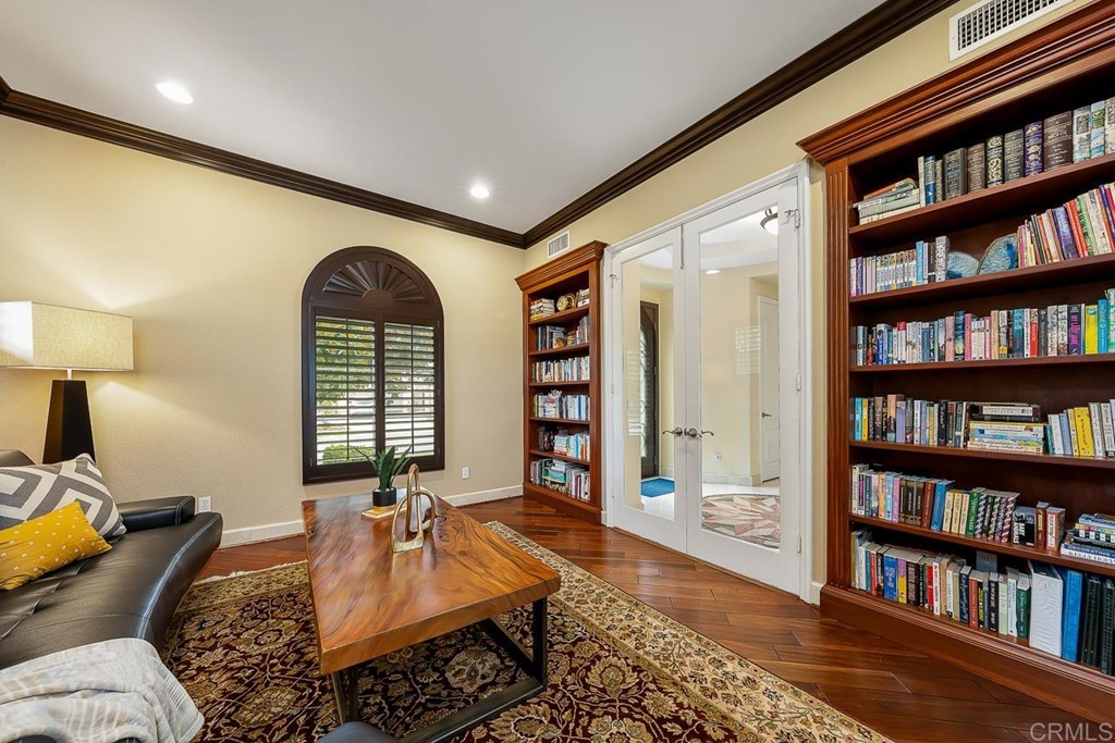 2786 Sutter Ridge Drive Chula Vista, CA 91914 - Photo 7 of 58 a living room with fireplace furniture and a book shelf