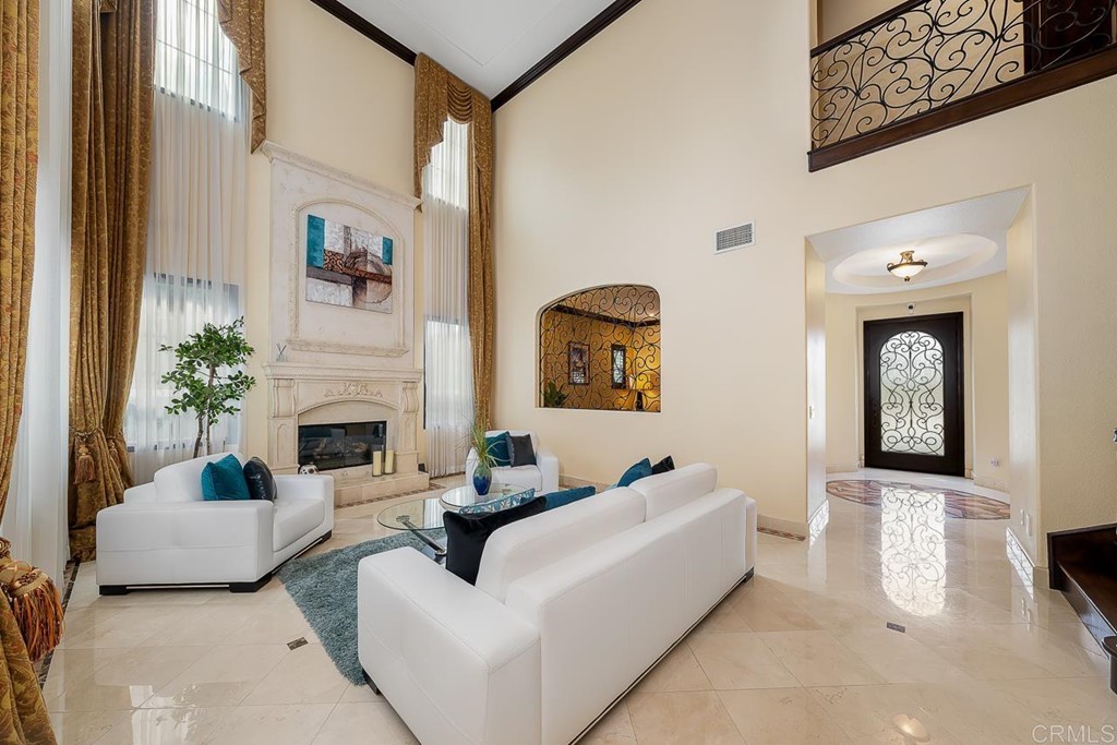 2786 Sutter Ridge Drive Chula Vista, CA 91914 - Photo 9 of 58 a living room with furniture a fireplace and a potted plant