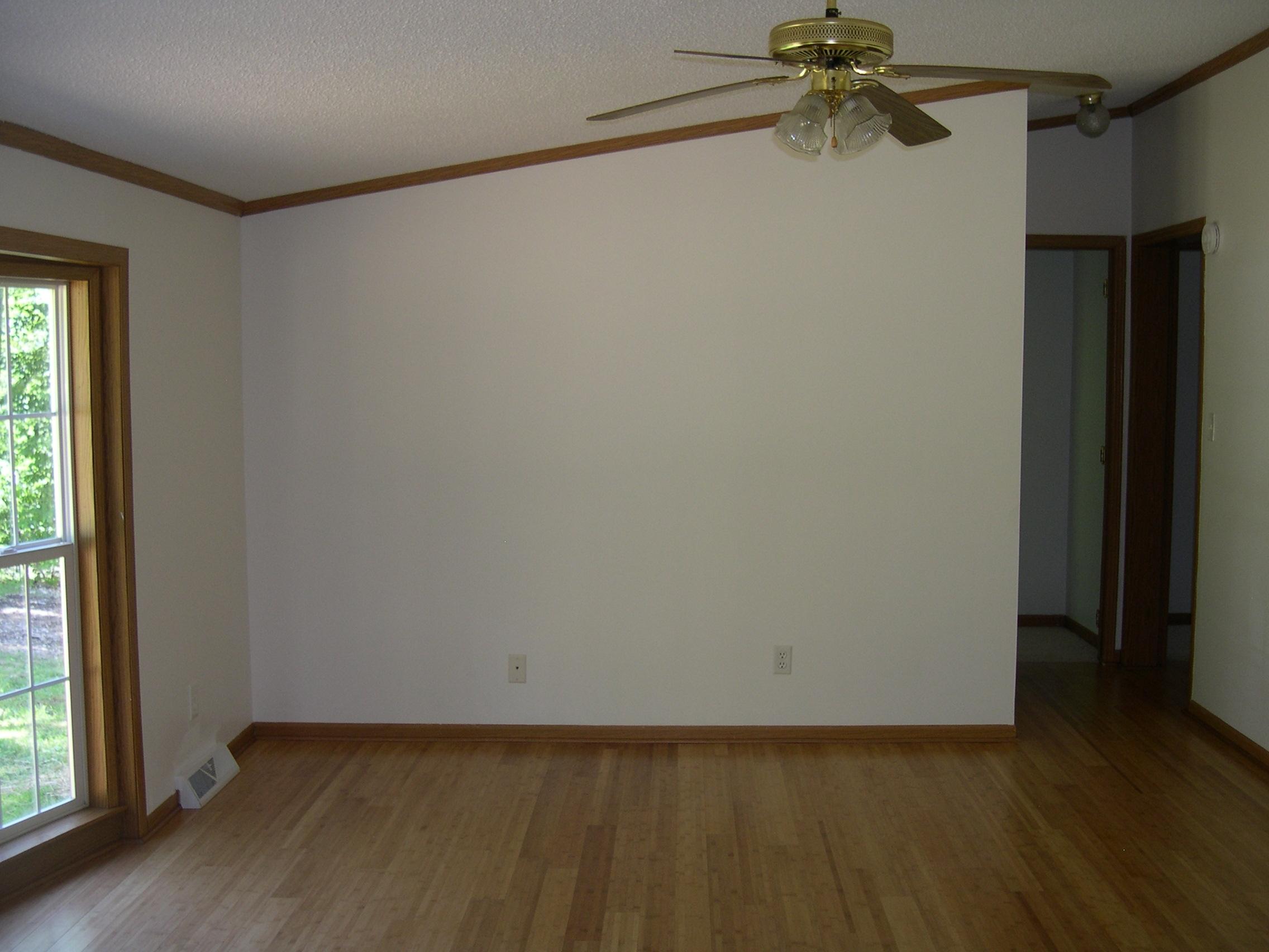 371 Northside Road Newport, VA 24128 - Photo 2 of 5 a view of an empty room with a window and wooden floor