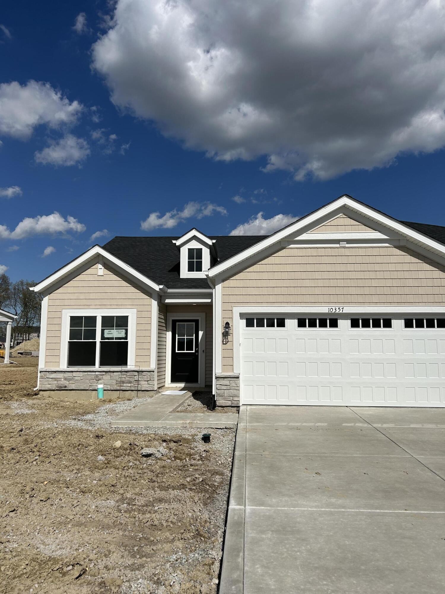 10357 Iowa Street Crown Point, IN 46307 - Photo 1 of 2 a view of a white house with a large space