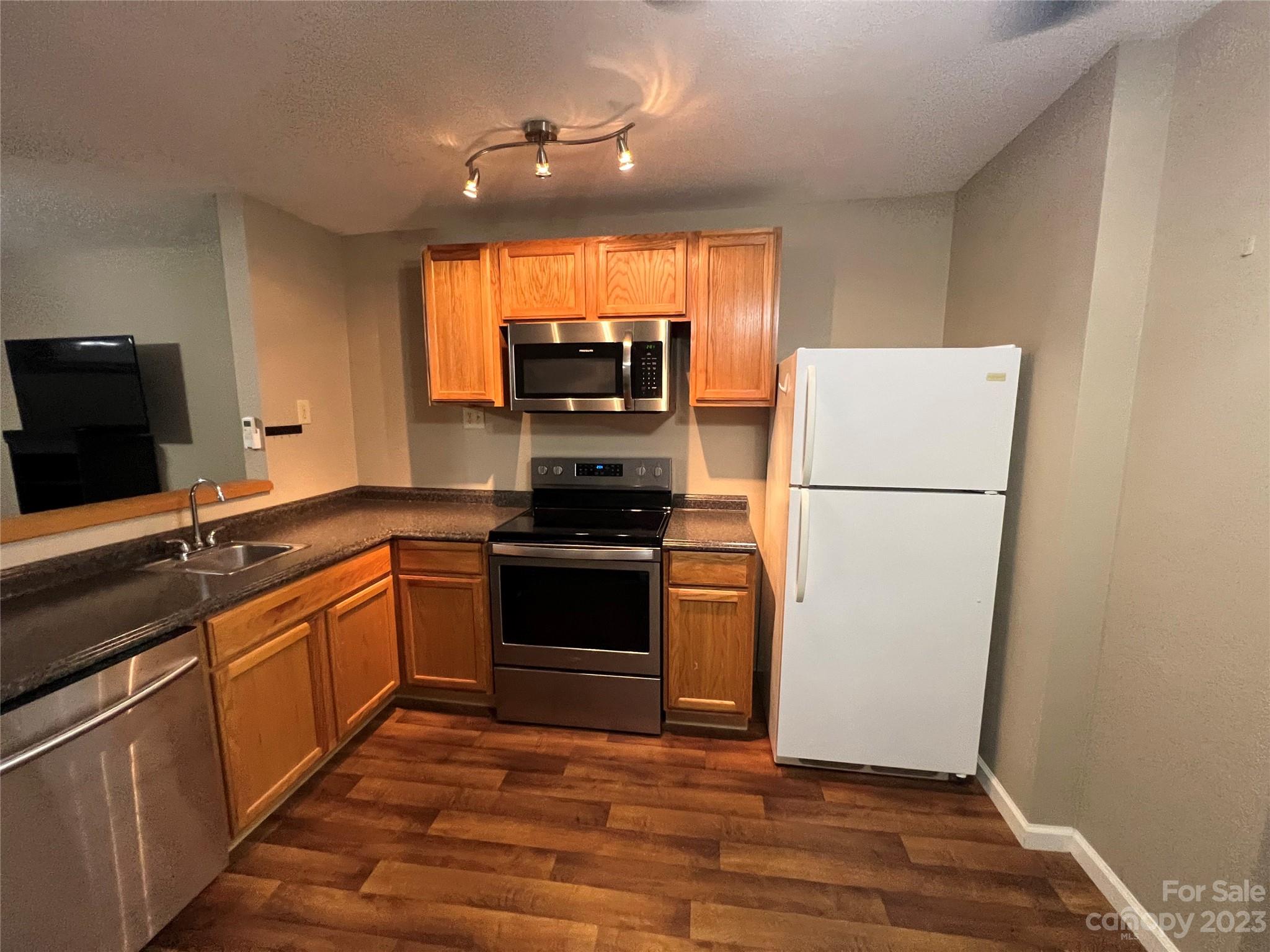 207 Whiteside Road Rutherfordton, NC 28139 - Photo 7 of 24 a kitchen with a refrigerator and a sink