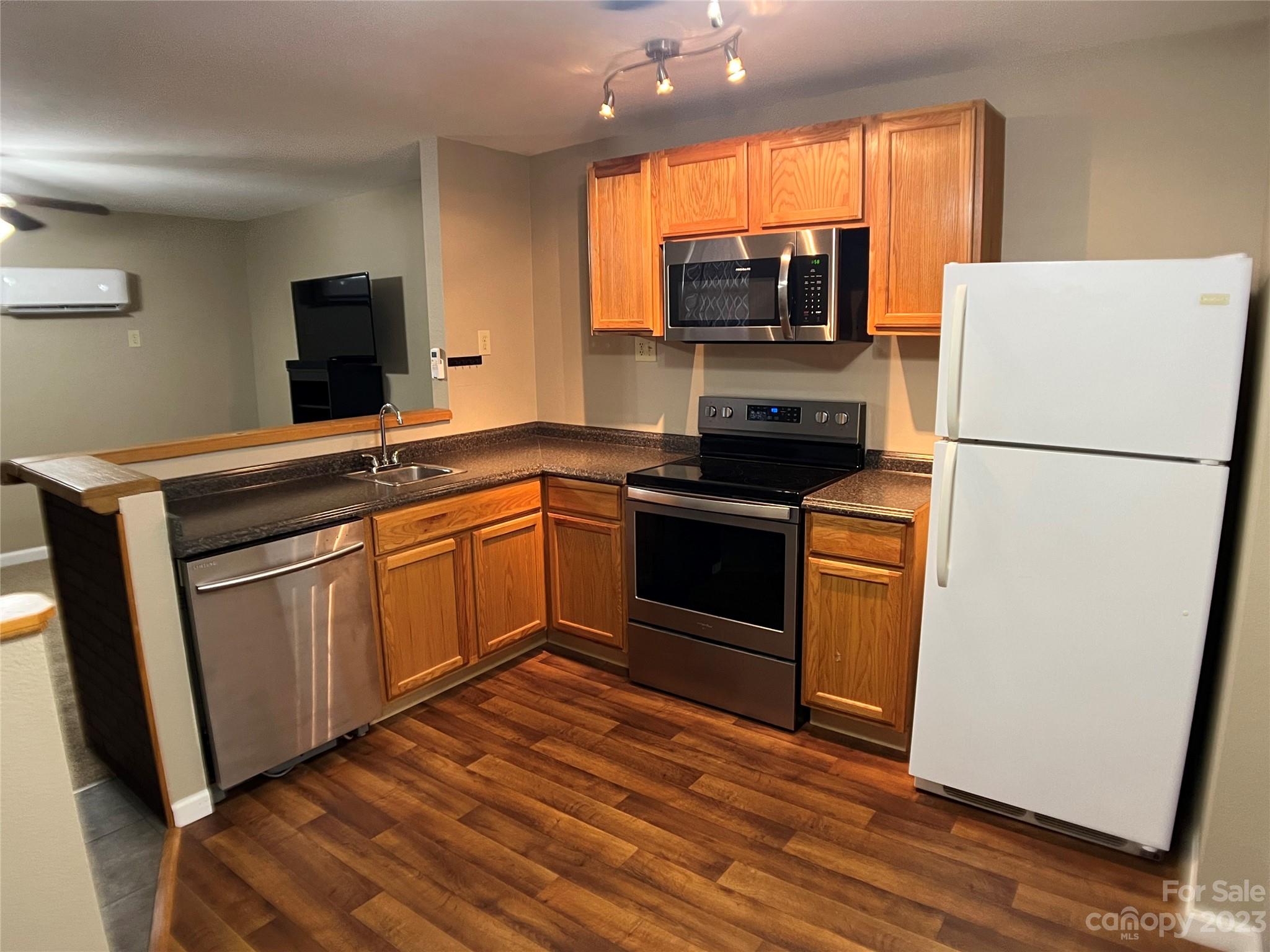 207 Whiteside Road Rutherfordton, NC 28139 - Photo 8 of 24 a kitchen with a sink and steel appliances