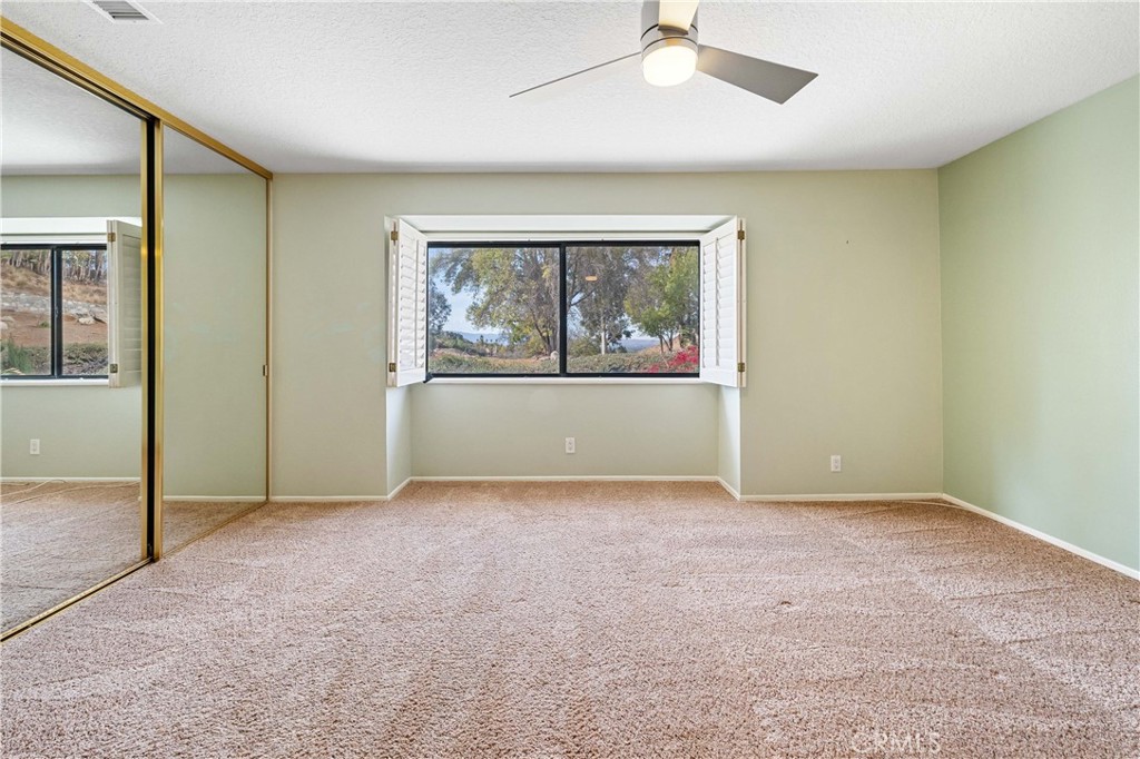 5855 Sunset Ranch Drive Riverside, CA 92506 - Photo 19 of 36 an empty room with windows