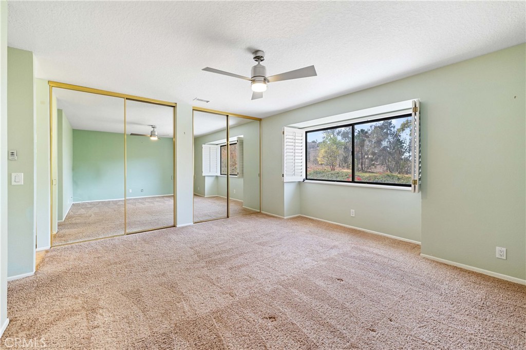 5855 Sunset Ranch Drive Riverside, CA 92506 - Photo 20 of 36 an empty room with fan and windows
