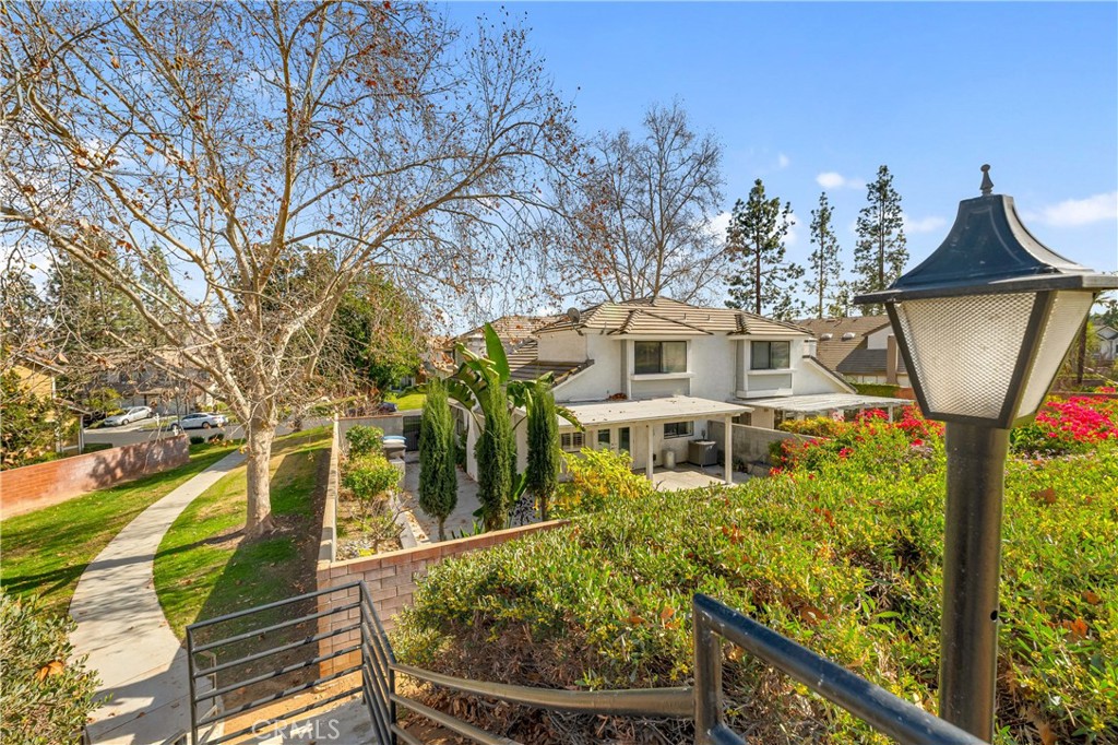 5855 Sunset Ranch Drive Riverside, CA 92506 - Photo 29 of 36 a front view of a house with garden