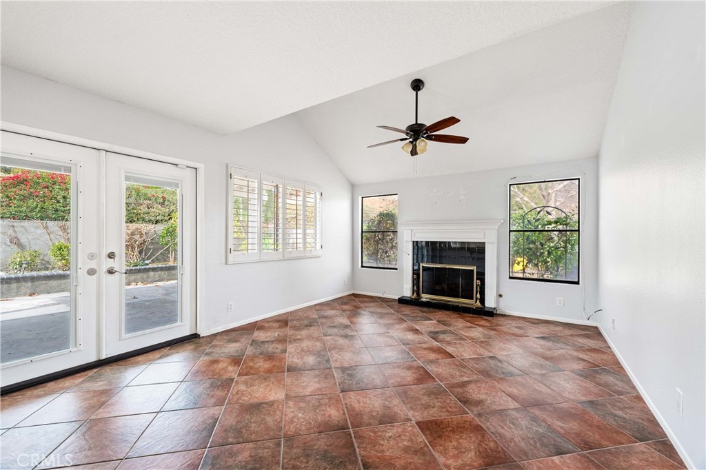 5855 Sunset Ranch Drive Riverside, CA 92506 - Photo 7 of 36 a view of empty room with fireplace and windows