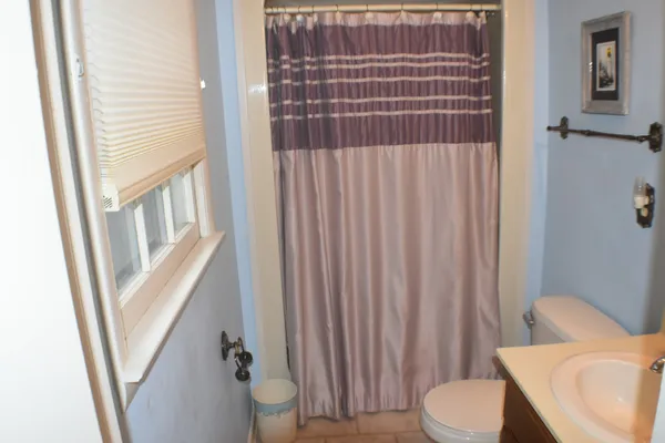 a bathroom with a sink and toilet