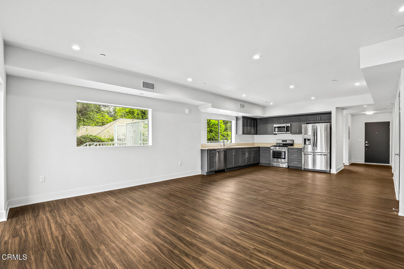 2000 Lake Avenue, Unit 4 Altadena, CA 91001 - Photo 7 of 20 a view of an empty room with wooden floor and windows