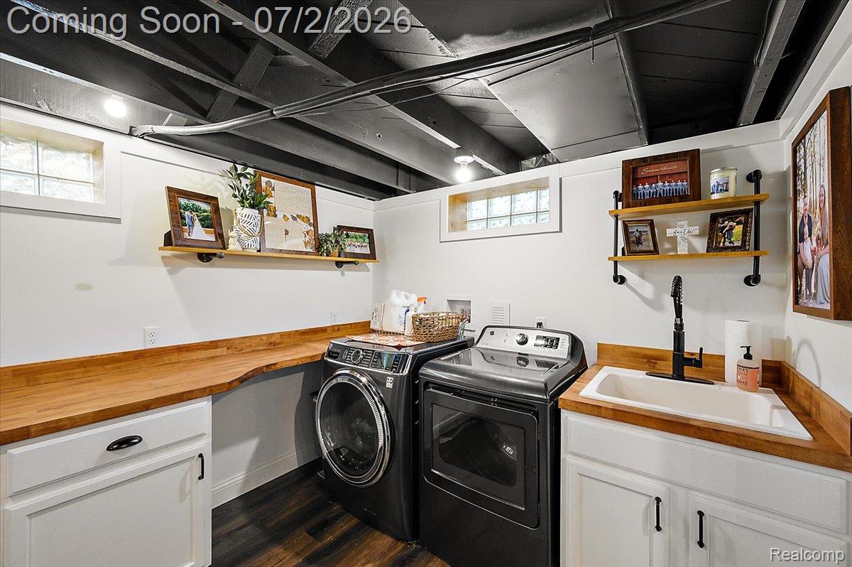 1706 Princeton Road Berkley, MI 48072 - Photo 34 of 49 Dedicated laundry area featuring a utility sink with a matte black faucet, wood-finish countertops, and white base cabinetry