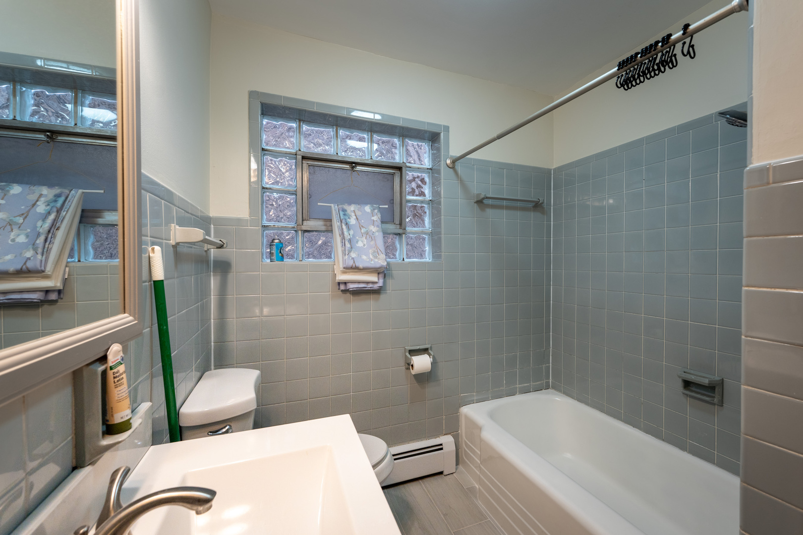1440 Maple Avenue, Unit 1 Berwyn, IL 60402 - Photo 13 of 23 a bathroom with a sink a toilet and shower