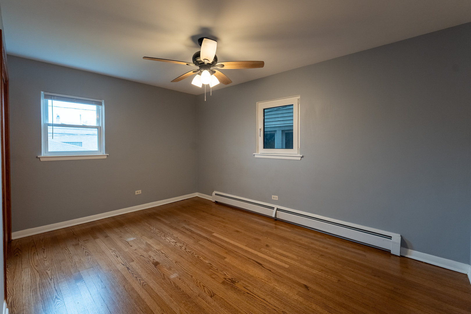 1440 Maple Avenue, Unit 1 Berwyn, IL 60402 - Photo 14 of 23 a view of an empty room with wooden floor and a window