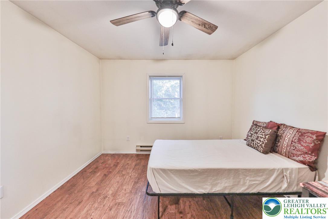 2114 Lakeview Road Bushkill, PA 18324 - Photo 37 of 83 Rich wood floors lay a warm foundation for this minimalist bedroom space.