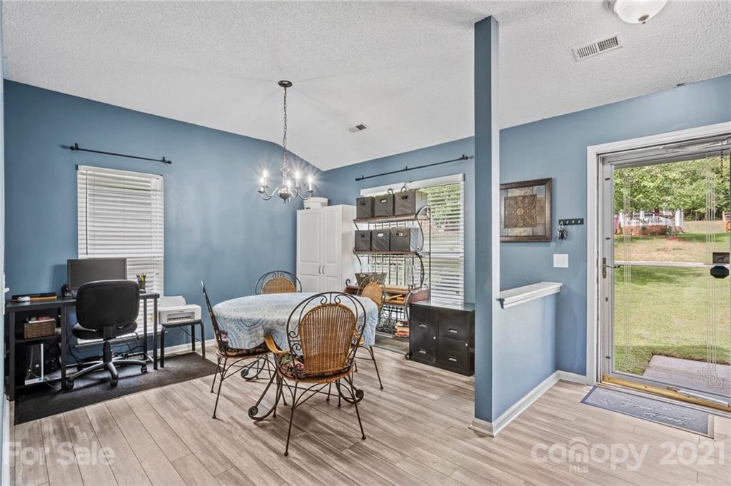 11204 Clayford Ridge Charlotte, NC 28215 - Photo 11 of 37 a view of a dining room with furniture window and outside view