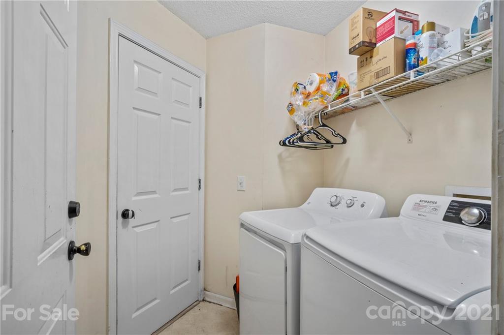 11204 Clayford Ridge Charlotte, NC 28215 - Photo 20 of 37 a utility room with dryer and washer