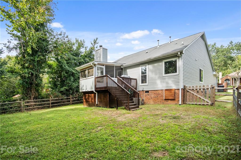 11204 Clayford Ridge Charlotte, NC 28215 - Photo 21 of 37 a view of house with backyard and trees
