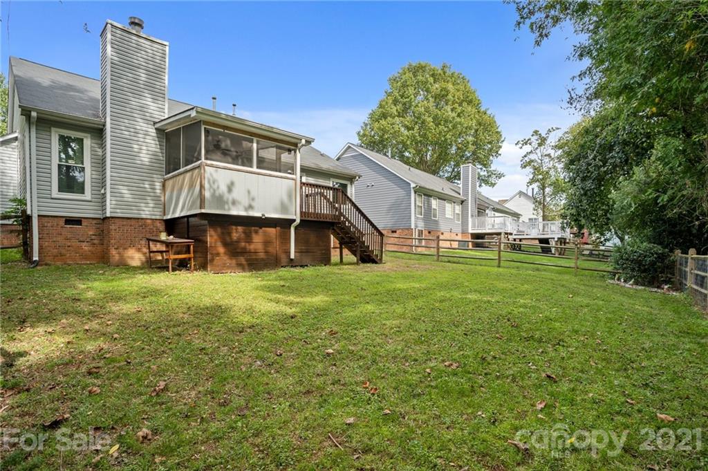 11204 Clayford Ridge Charlotte, NC 28215 - Photo 22 of 37 a front view of a house with a yard