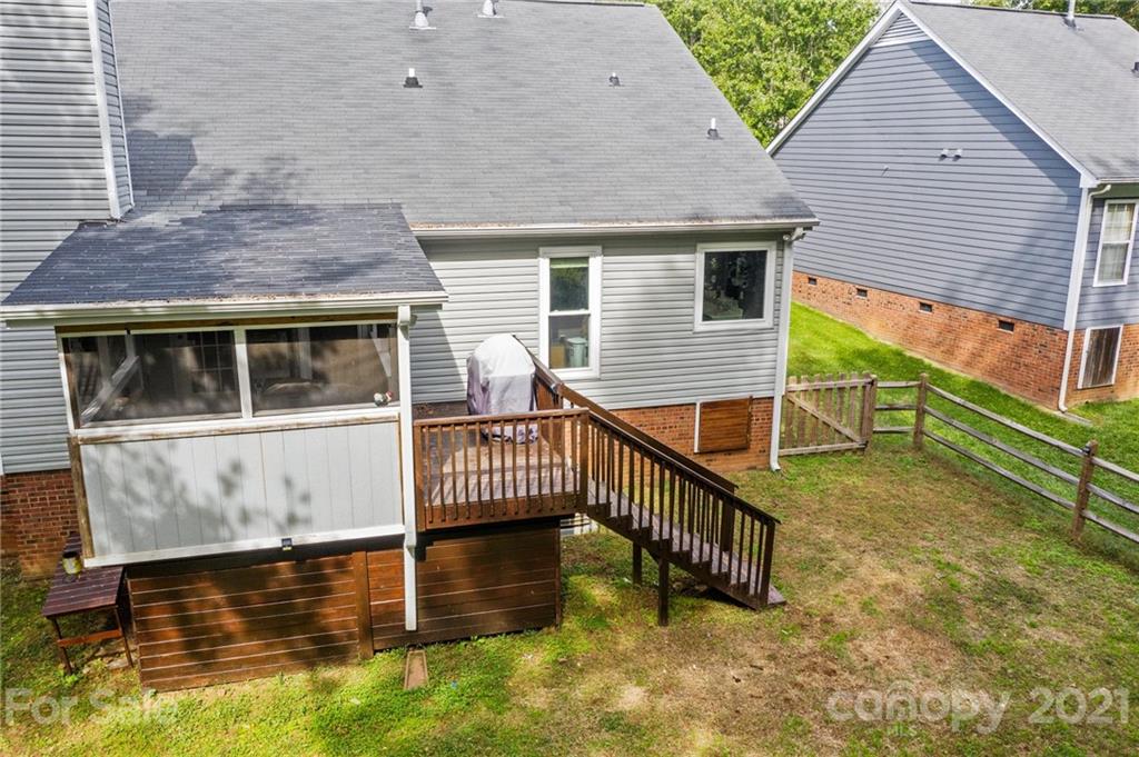 11204 Clayford Ridge Charlotte, NC 28215 - Photo 30 of 37 a view of a house with a wooden deck