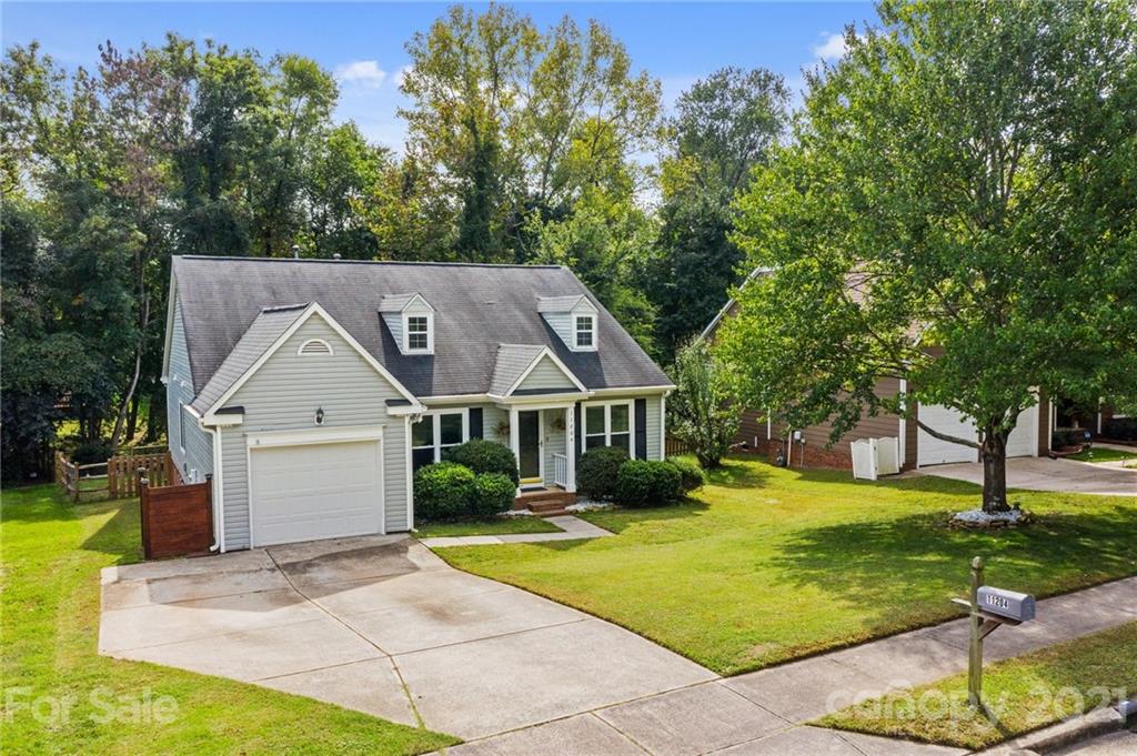 11204 Clayford Ridge Charlotte, NC 28215 - Photo 35 of 37 a front view of a house with a yard