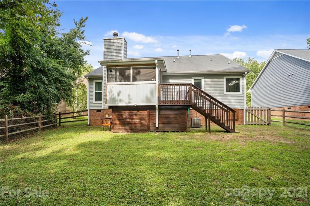 11204 Clayford Ridge Charlotte, NC 28215 - Photo 37 of 37 a view of a house with a yard and sitting area