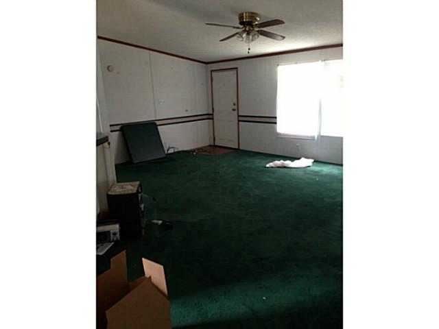 10901 Maha Loop Road Austin, TX 78719 - Photo 1 of 1 a view of a livingroom with a fan