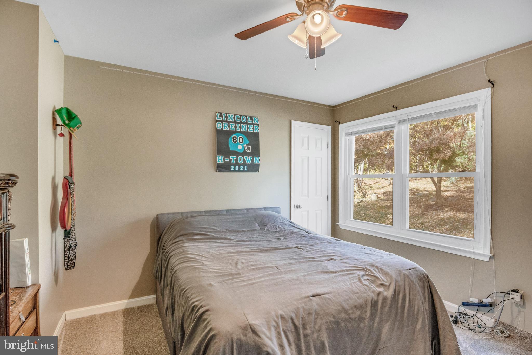 920 Carson Road Huntingtown, MD 20639 - Photo 14 of 32 a bedroom with a bed and a window