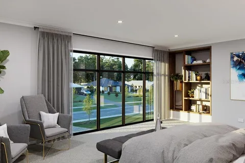 a bedroom with furniture and a large window