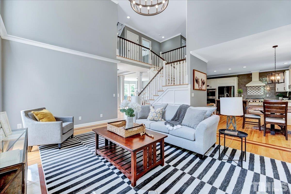7033 Daniel Road Wake Forest, NC 27587 - Photo 17 of 63 a living room with furniture a rug and white walls