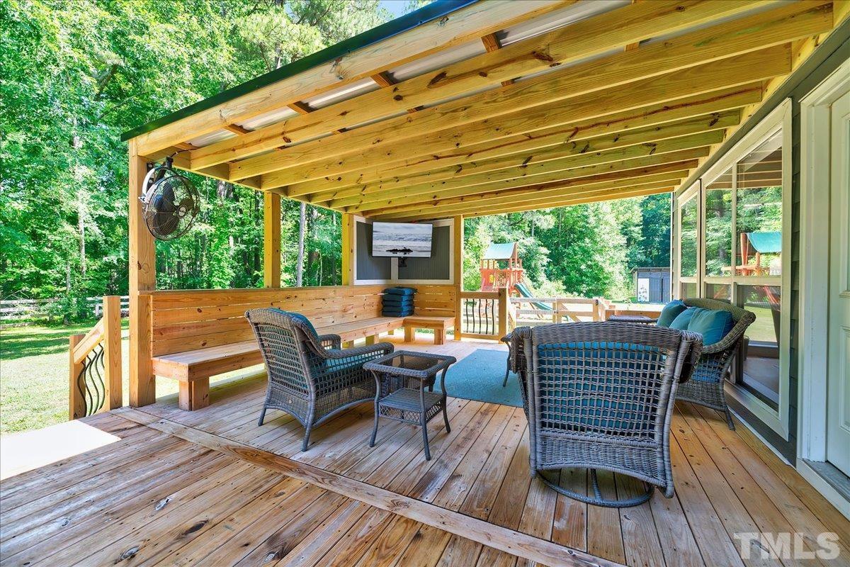 7033 Daniel Road Wake Forest, NC 27587 - Photo 47 of 63 a view of a patio on the deck