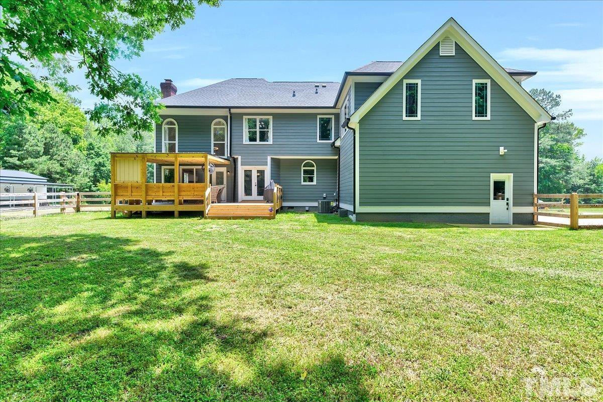 7033 Daniel Road Wake Forest, NC 27587 - Photo 52 of 63 a front view of a house with garden