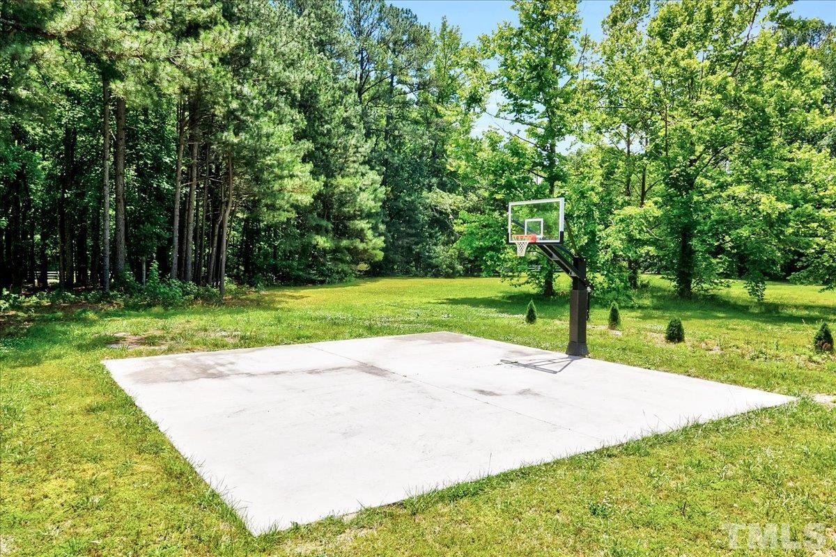7033 Daniel Road Wake Forest, NC 27587 - Photo 58 of 63 a view of a park with large trees