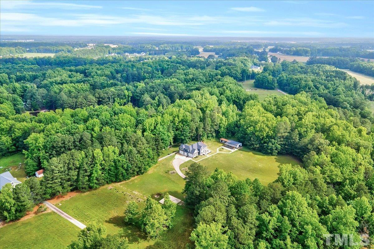 7033 Daniel Road Wake Forest, NC 27587 - Photo 60 of 63 a view of a yard with an trees