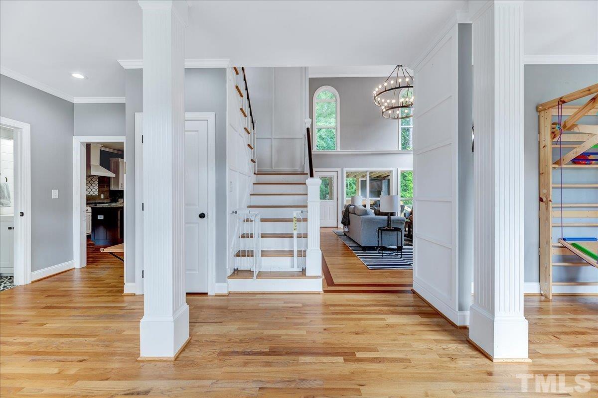 7033 Daniel Road Wake Forest, NC 27587 - Photo 6 of 63 a view of a livingroom with wooden floor furniture and staircase