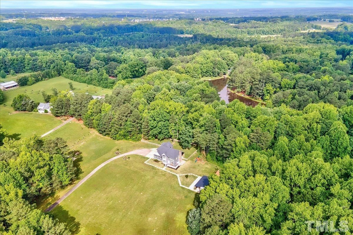 7033 Daniel Road Wake Forest, NC 27587 - Photo 62 of 63 a view of a forest with an outdoor space