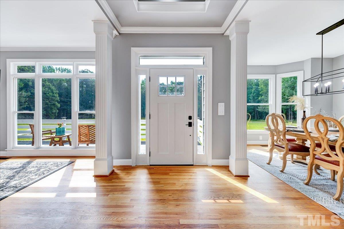 7033 Daniel Road Wake Forest, NC 27587 - Photo 7 of 63 a view of a livingroom with furniture window and wooden floor