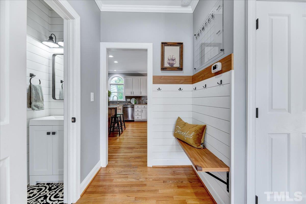 7033 Daniel Road Wake Forest, NC 27587 - Photo 9 of 63 a hallway with furniture and stairs