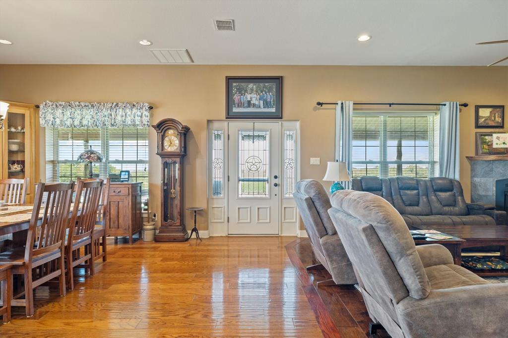 2801 Agnes Circle Springtown, TX 76082 - Photo 13 of 40 a living room with furniture fireplace and wooden floor