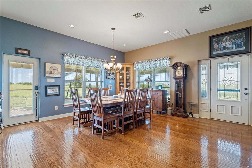 2801 Agnes Circle Springtown, TX 76082 - Photo 14 of 40 a view of a dining room with furniture window and wooden floor