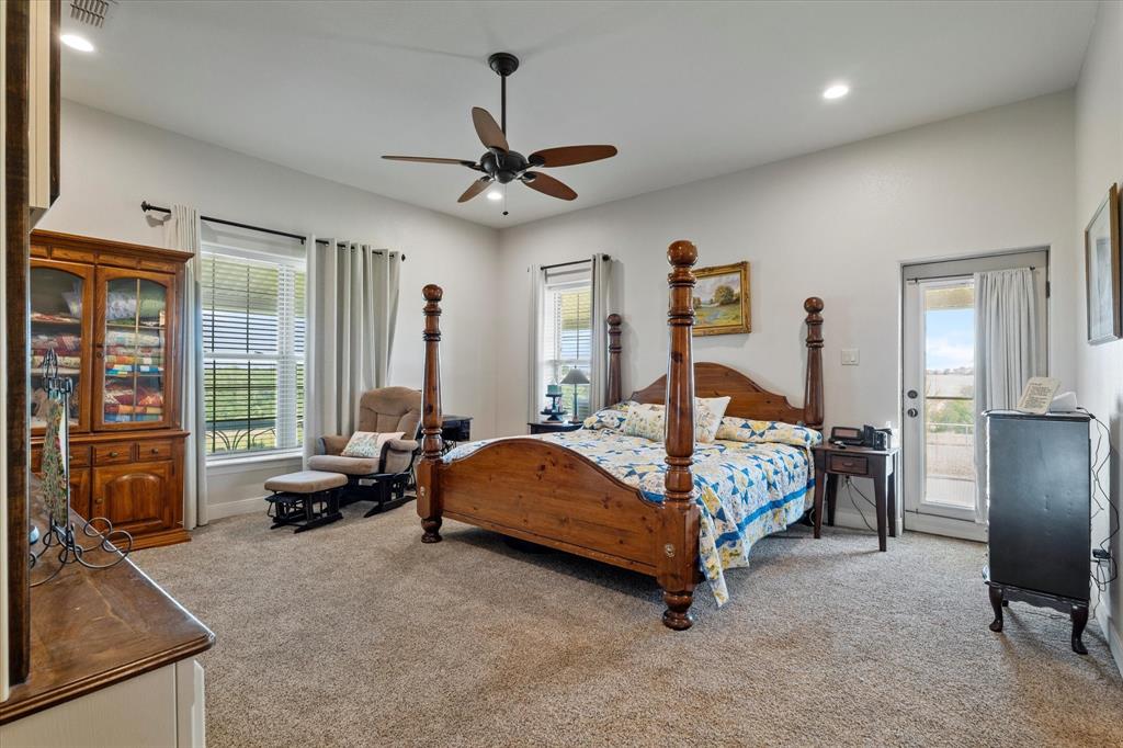 2801 Agnes Circle Springtown, TX 76082 - Photo 20 of 40 a bed room with furniture and a flat screen tv