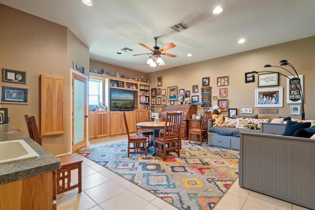 2801 Agnes Circle Springtown, TX 76082 - Photo 24 of 40 a view of a dining room with furniture window and wooden floor