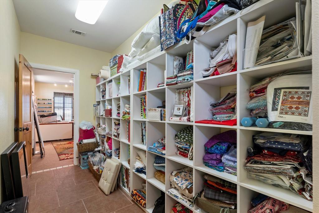 2801 Agnes Circle Springtown, TX 76082 - Photo 29 of 40 walk in closet with clothes and shoes