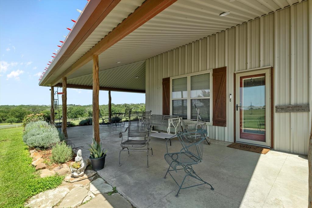2801 Agnes Circle Springtown, TX 76082 - Photo 35 of 40 a patio with yard table and chairs