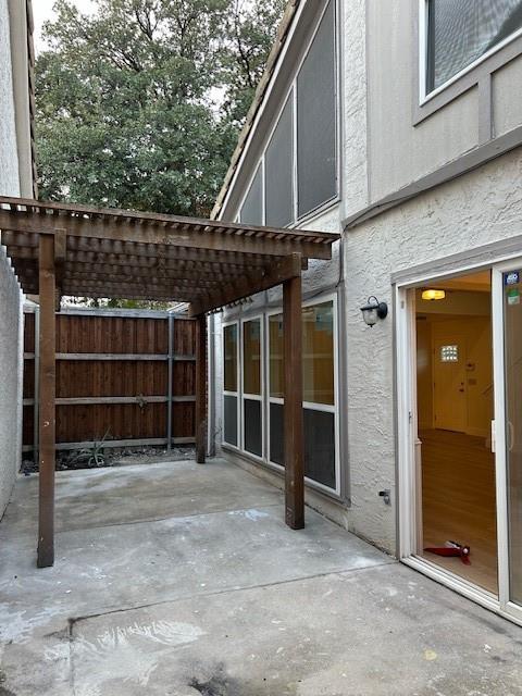 17119 Upper Bay Road Addison, TX 75001 - Photo 29 of 29 a view of a house with a large window and wooden fence