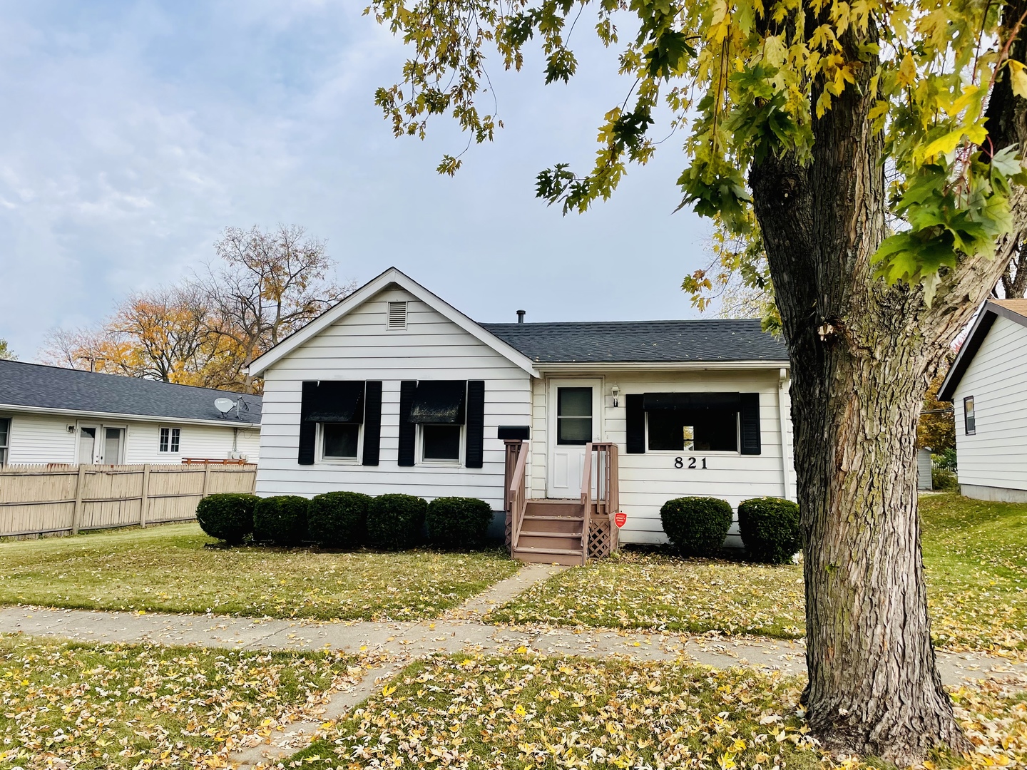 821 North Main Street Rochelle, IL 61068 - Photo 3 of 22 a front view of a house with a yard