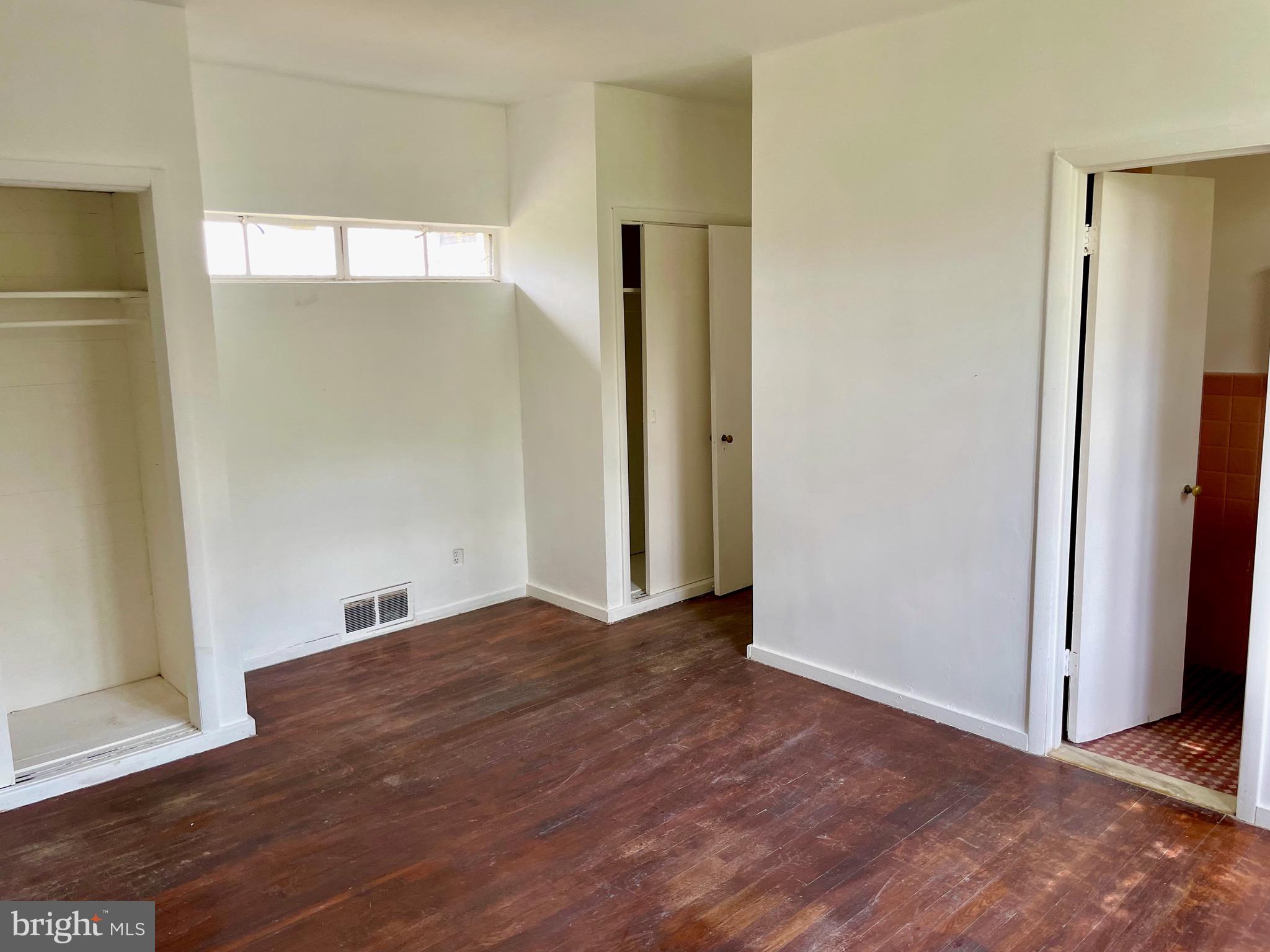119 Robbins Avenue Jenkintown, PA 19046 - Photo 11 of 65 a view of an empty room with wooden floor and a window