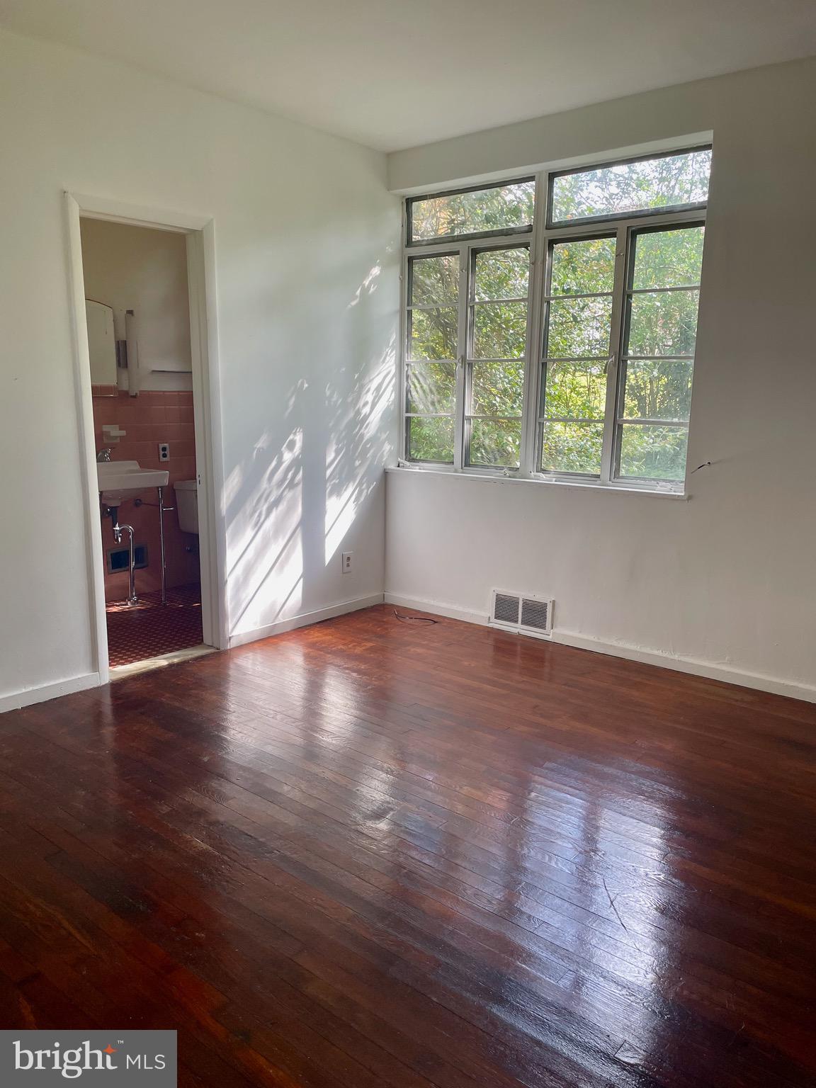 119 Robbins Avenue Jenkintown, PA 19046 - Photo 20 of 65 a view of empty room with wooden floor and fan