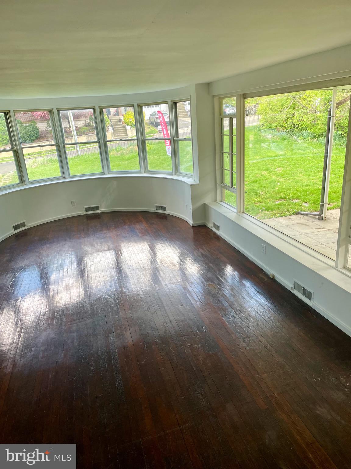 119 Robbins Avenue Jenkintown, PA 19046 - Photo 2 of 65 a view of an empty room with wooden floor and a window