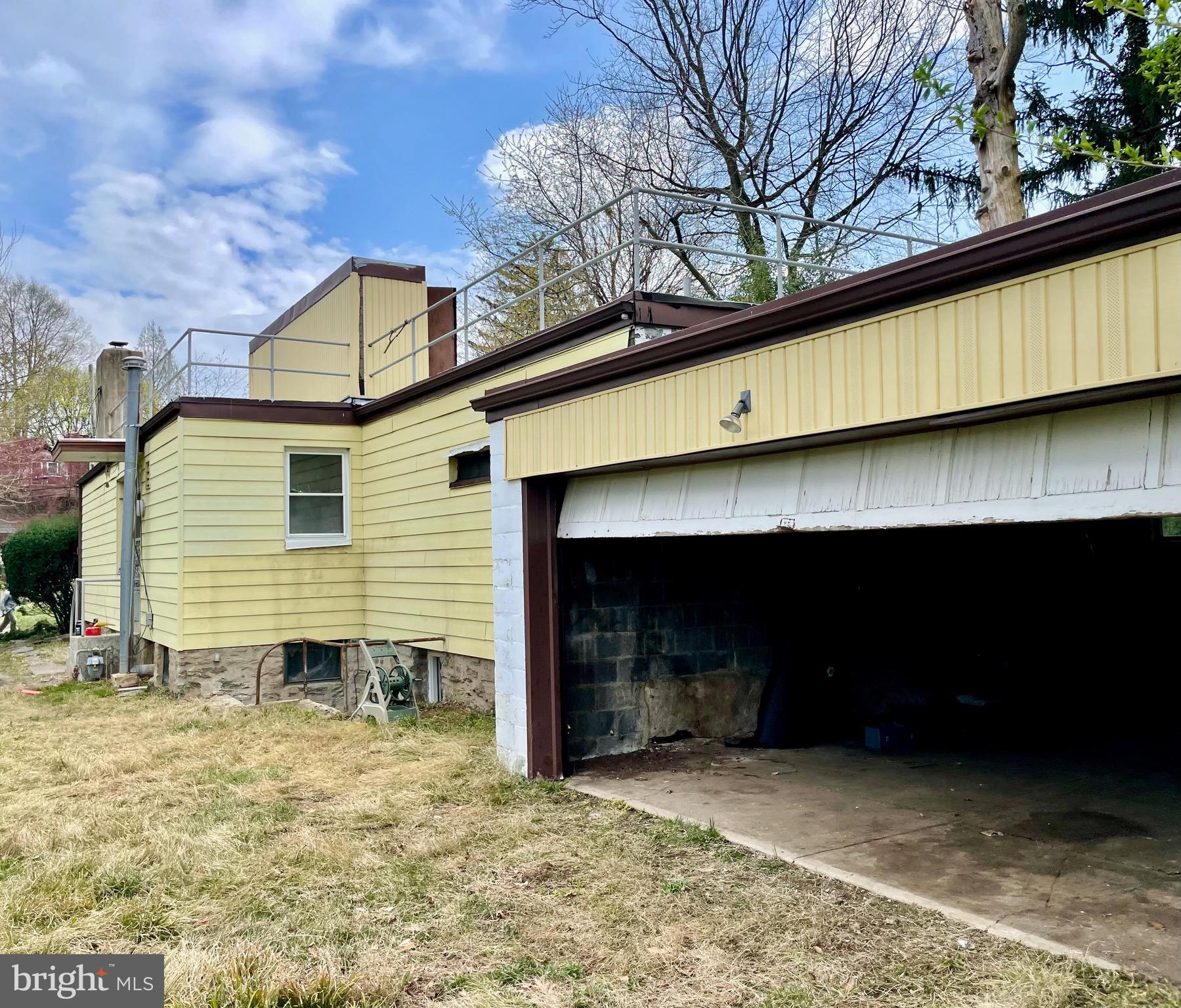 119 Robbins Avenue Jenkintown, PA 19046 - Photo 35 of 65 a view of a house with a yard and garage